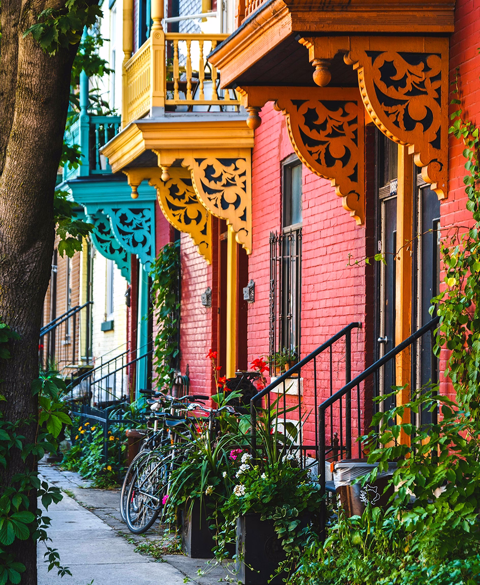 Colourful Montreal city street scene with balconies and architectural details, a source of creative inspiration for Tawn Moore